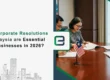 Business professionals signing corporate resolutions in Malaysia with national flag on table – Why corporate resolutions are essential for businesses in 2026